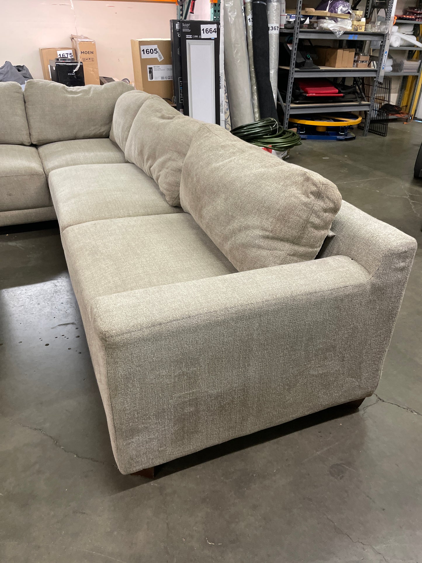 Costco - Raylin Fabric Sectional with Ottoman - Retail $1599