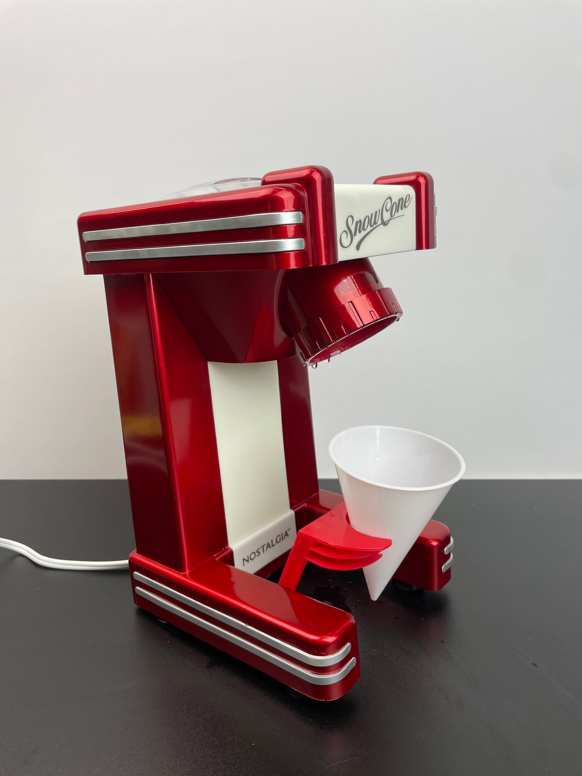 Nostalgia Snow Cone Shaved Ice Machine - Retro Table-Top Slushie Machine Makes 20 Icy Treats - Includes 1 Reusable Plastic Cup - Retro Red - Retail $37